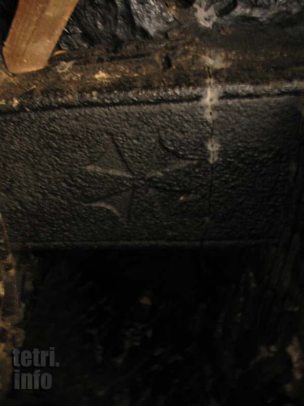 Tower Salkhino. Spiral stairs. Beam with a cross